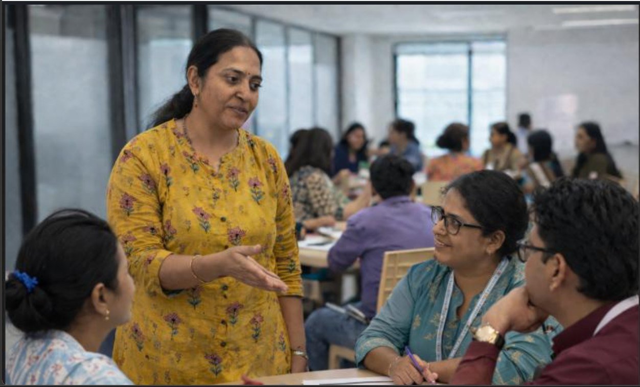 Achuta facilitating a small-group discussion